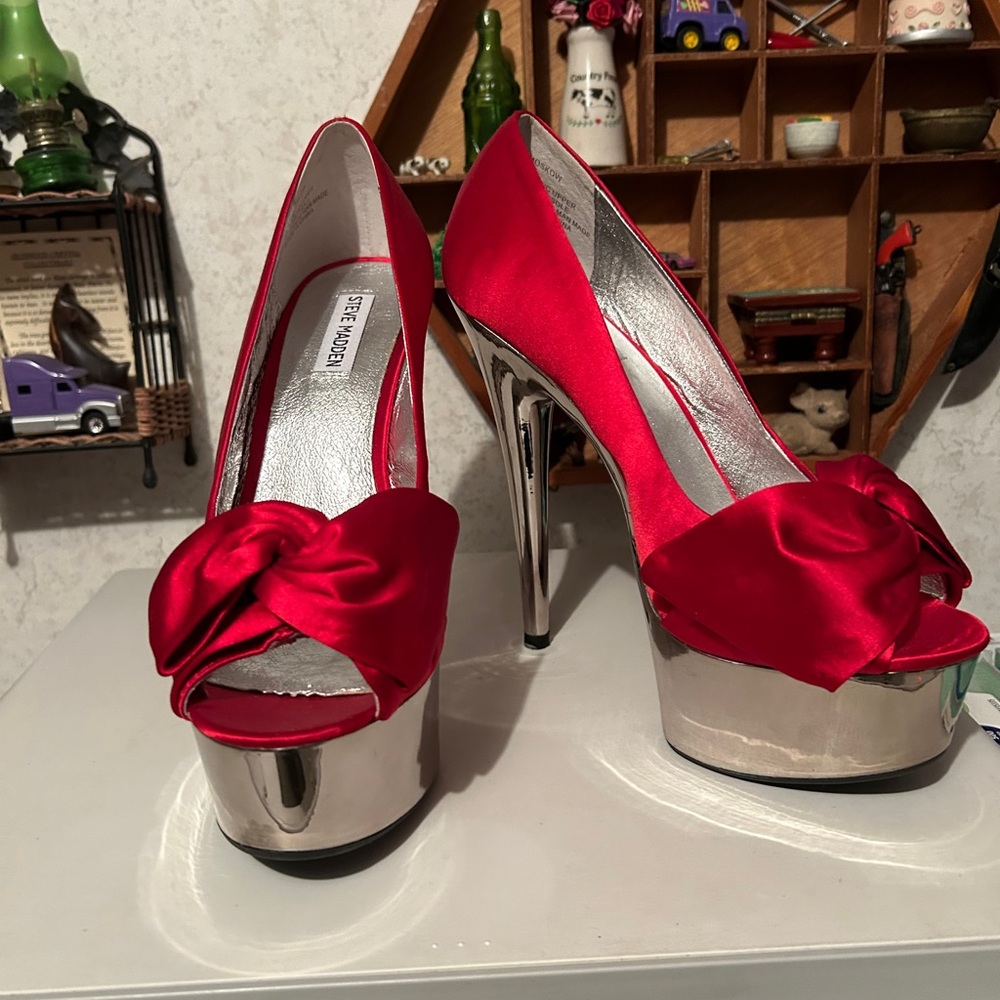 Vibrant red spike heels with silver soles